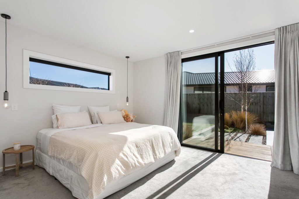Bright modern bedroom in a new build home, suitable for 2 bedroom house or 3 bedroom house buyers searching for affordable homes, luxury homes, and modern houses for sale within house and land packages and homes for sale listings.