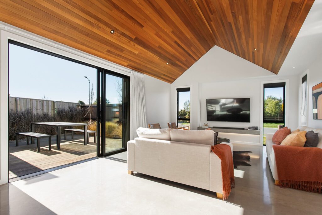 Spacious modern house design with high timber ceilings and indoor outdoor flow, highlighting luxury homes and architectural property for sale.