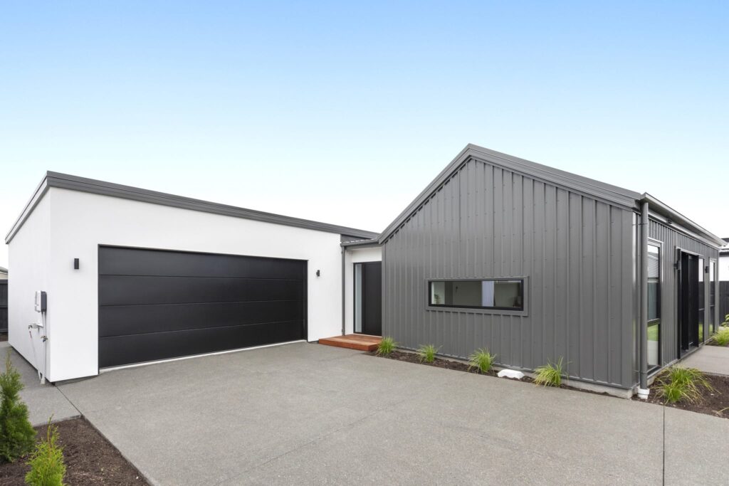 Driveway and garage view of a modern house design showcasing a new build home within a house and land package.