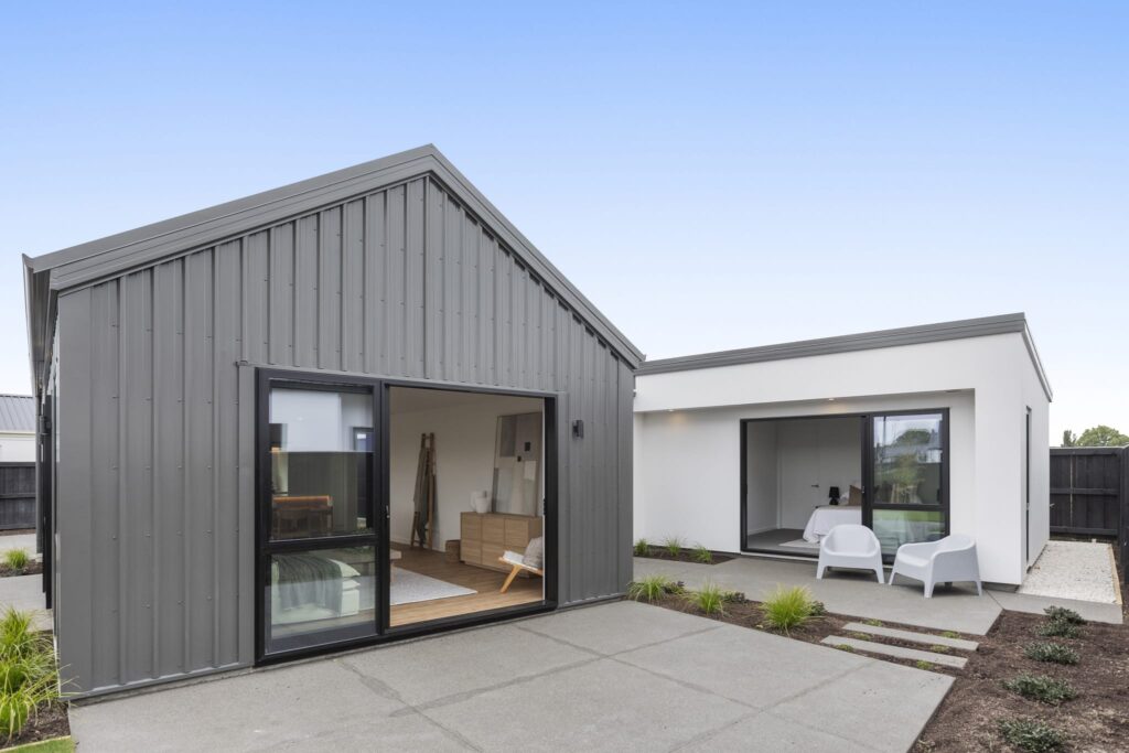 Two modern houses arranged around a private courtyard, highlighting house and land packages, home and land packages and new homes for sale designed for comfortable modern living.