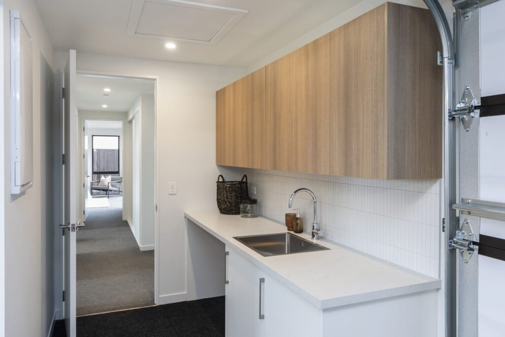 Functional laundry space in a modern house showcasing practical design in new build homes.