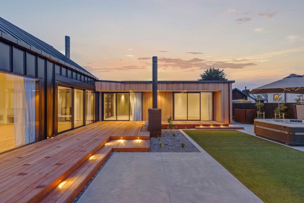 Open plan kitchen in a modern house, showcasing sleek finishes and natural light, ideal for new homes and modern house living.
