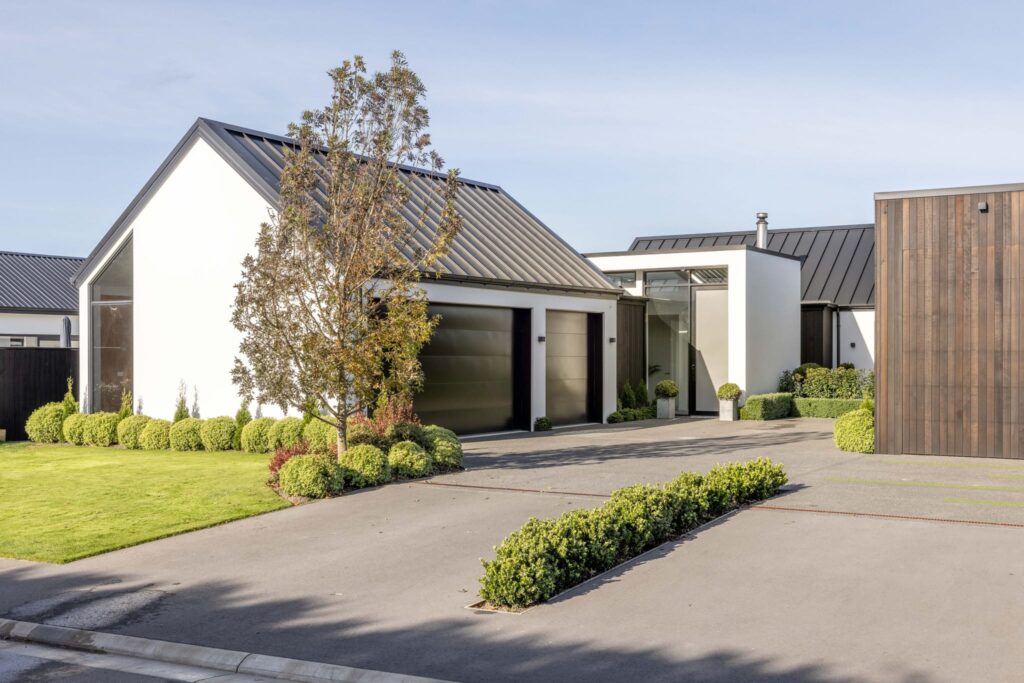 mohs_developments_canterbury_projects_11_ashford_avenue_1 Modern residential property exterior featuring a new build house with landscaped gardens and architectural styling.