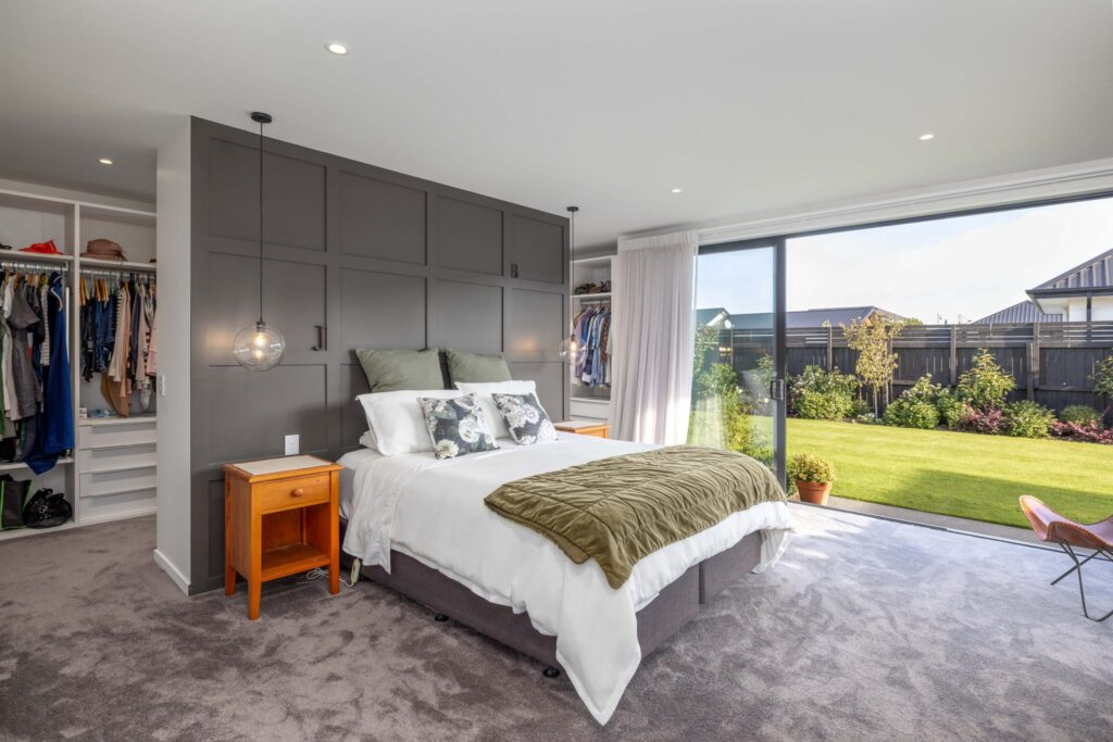 mohs_developments_canterbury_projects_11_ashford_avenue_8 Spacious master bedroom in a modern house with garden access, suitable for listing new homes for sale, 3 bedroom houses, and luxury homes.